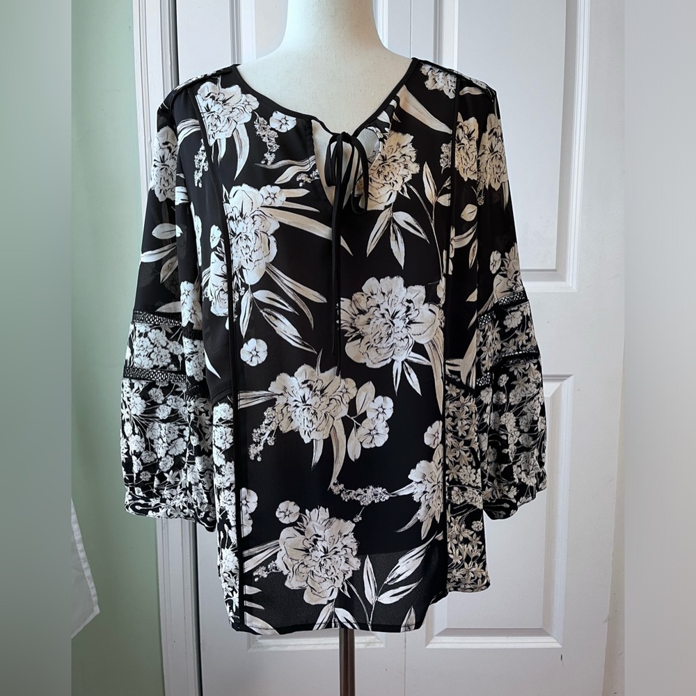 Karl Largerfeld blouse size M with contrasting prints and tie front.